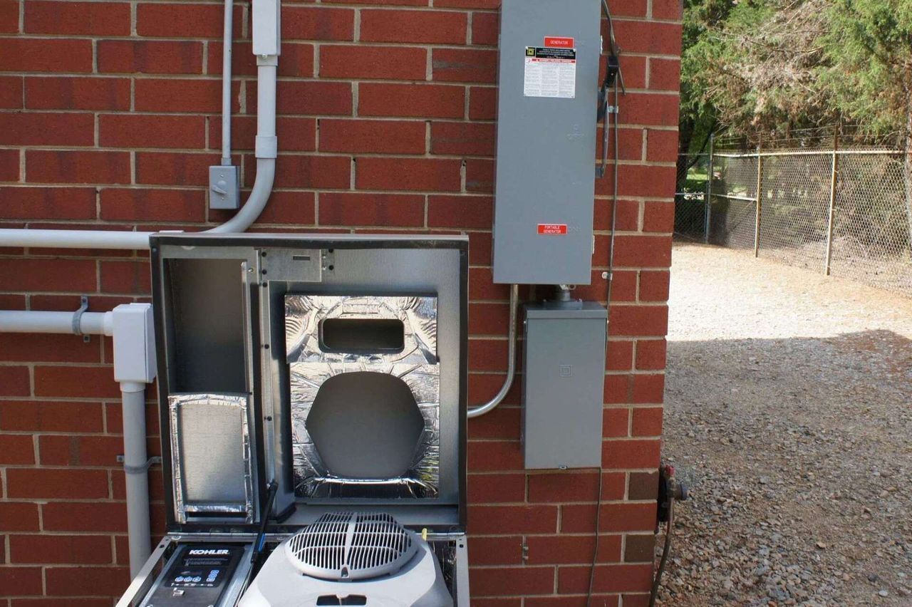 A brick wall with a box that says ' electrical ' on it