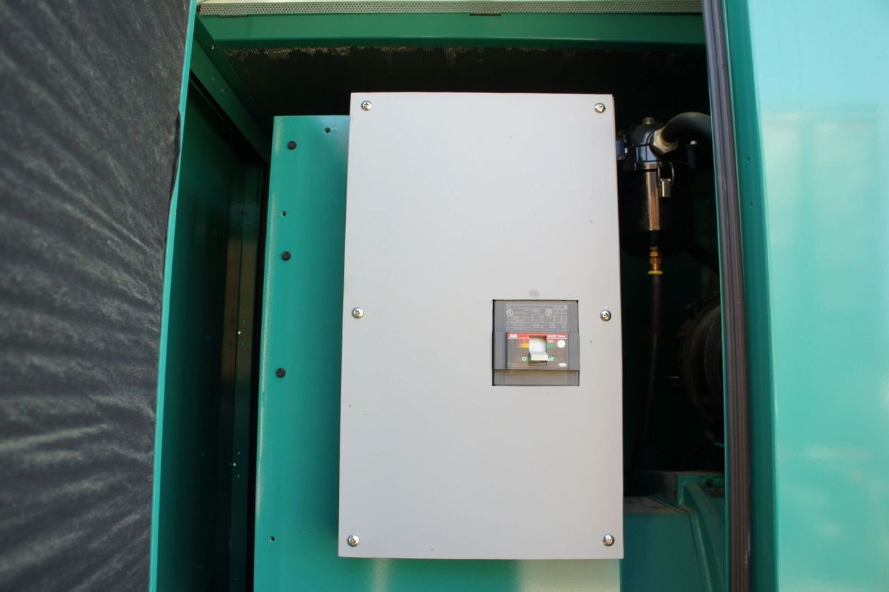 A white box is sitting inside of a green box.