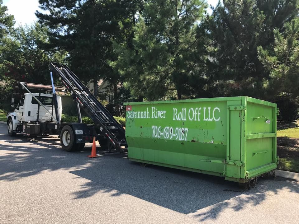 A green dumpster from savannah river roll off llc