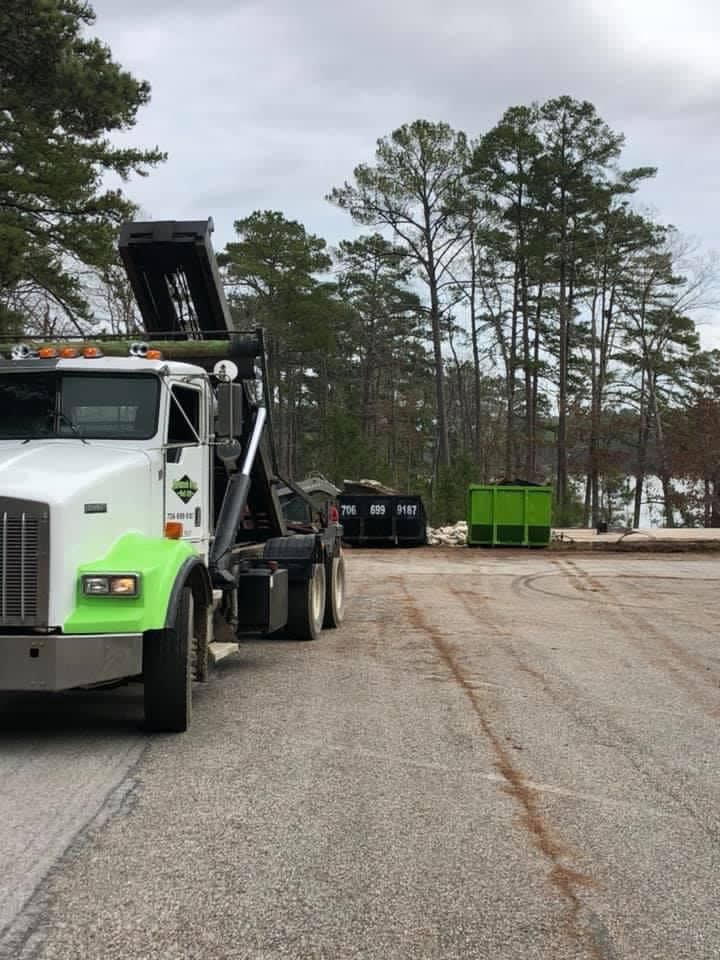 A dump truck is parked on the side of the road.