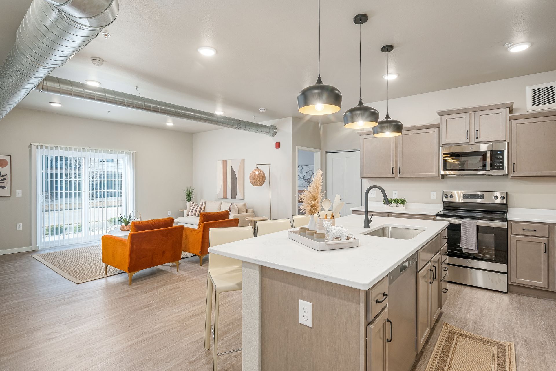 A kitchen with a large island in the middle of the room.