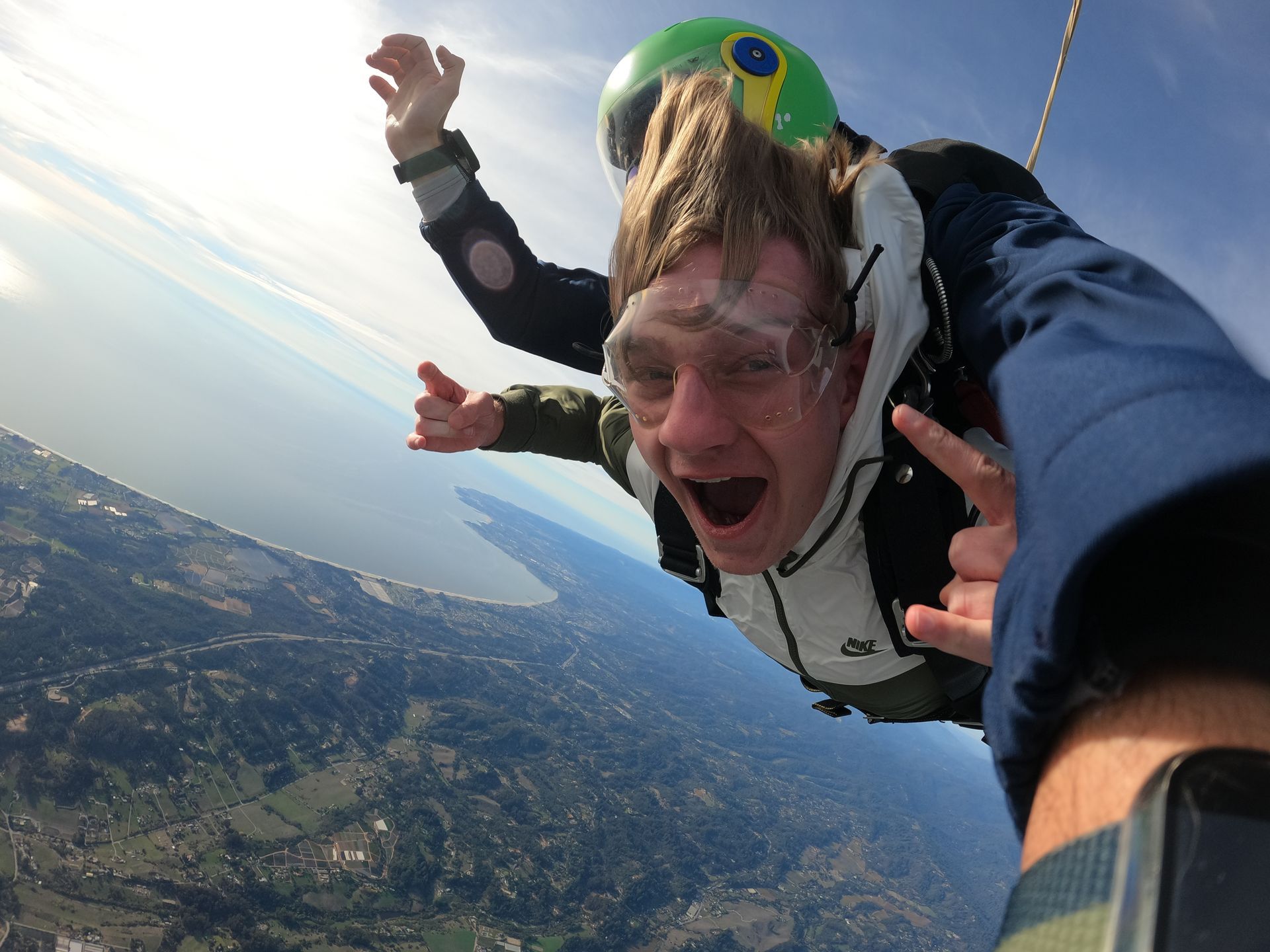 Skydive Santa Cruz student freefalling through the air during a tandem jump.
