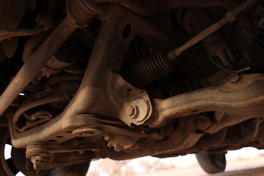 A Close Up of the Underside of a Rusty Car — T&C Smash Repairs In Coffs Harbour, NSW
