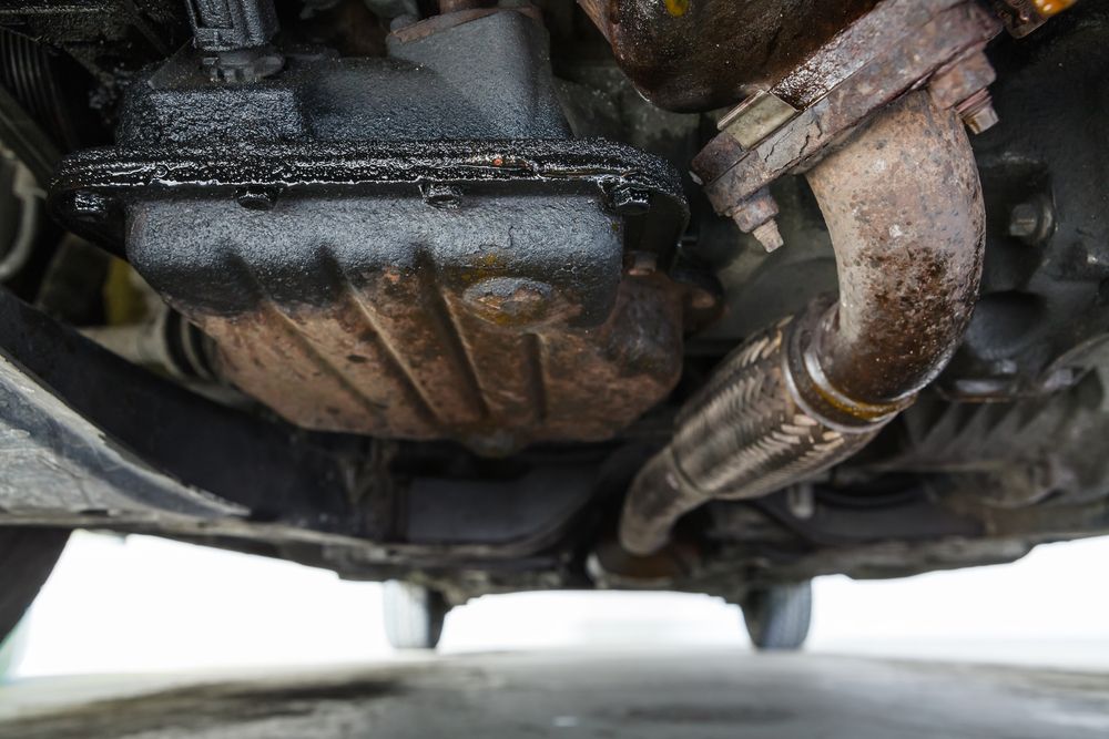 A Close Up of the Underside of a Car With a Exhaust Pipe — T&C Smash Repairs In Coffs Harbour, NSW