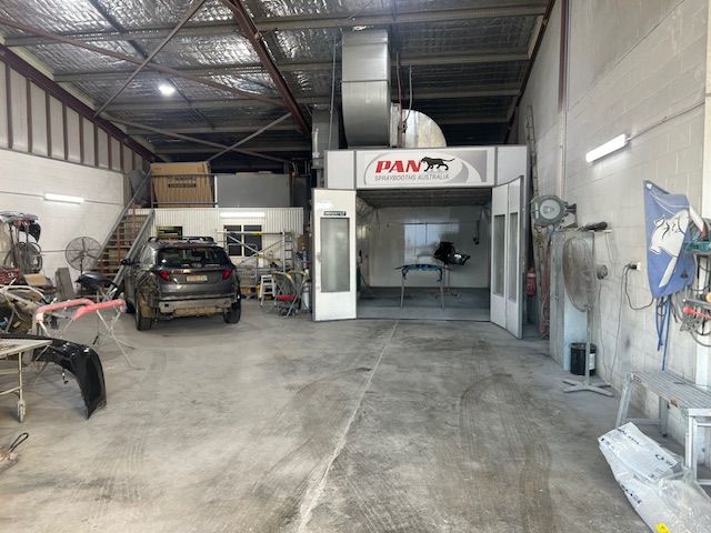Interior of a Car Repair Shop With a Paint Booth — T&C Smash Repairs In Coffs Harbour, NSW