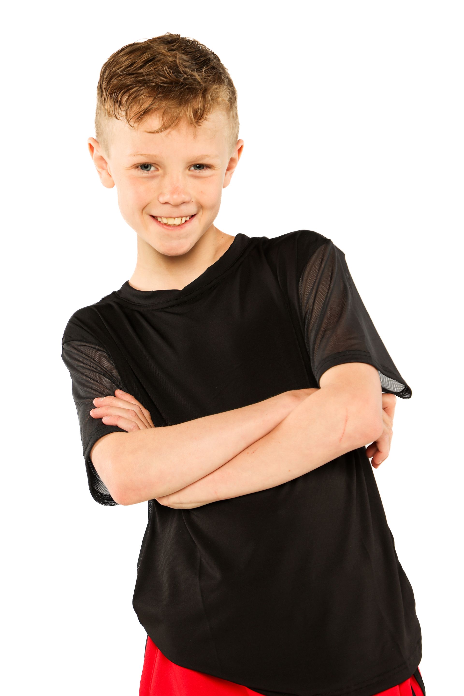Smiling person in a black shirt with arms crossed on a white background