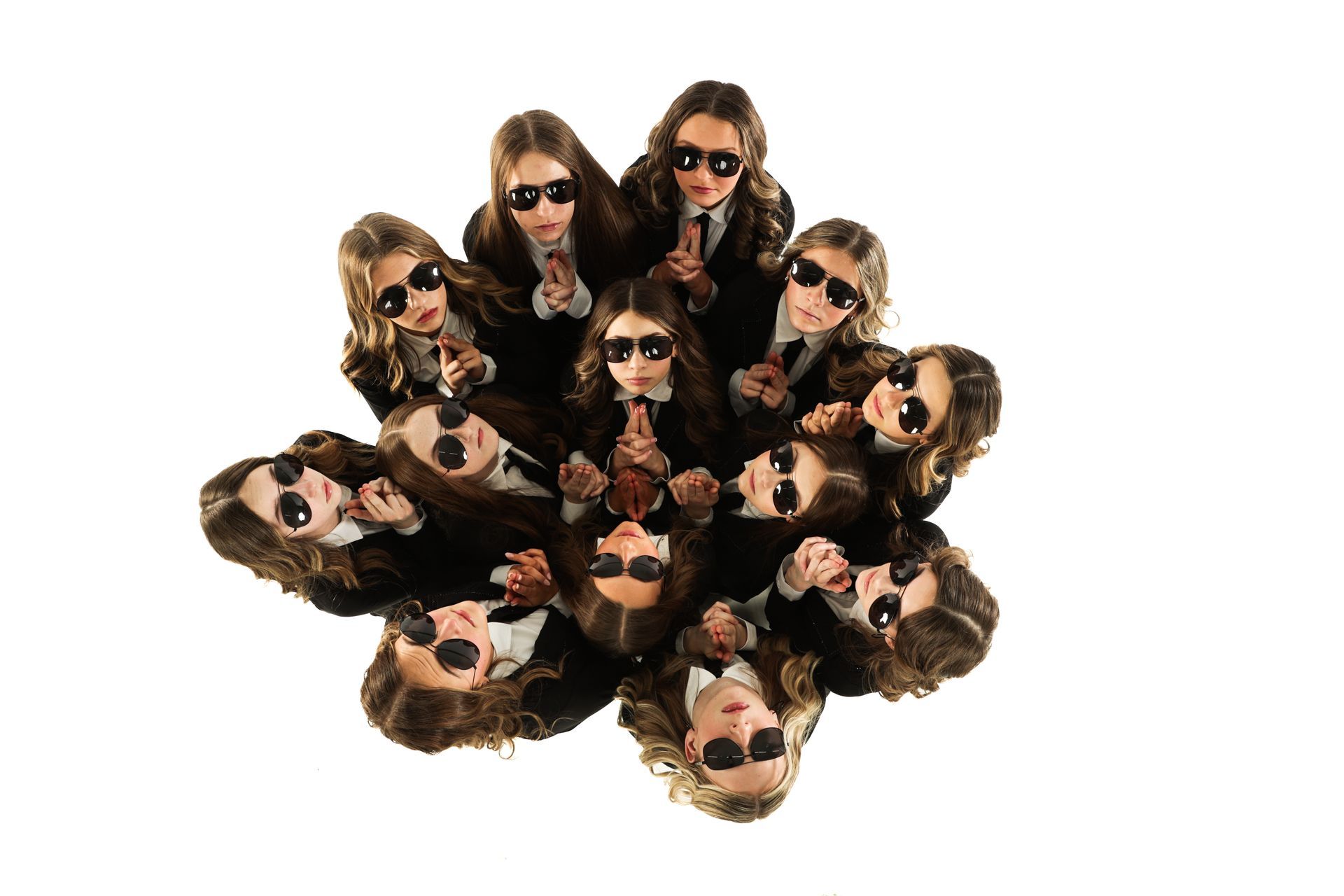 Group of people wearing sunglasses arranged in a circular starburst on a white background