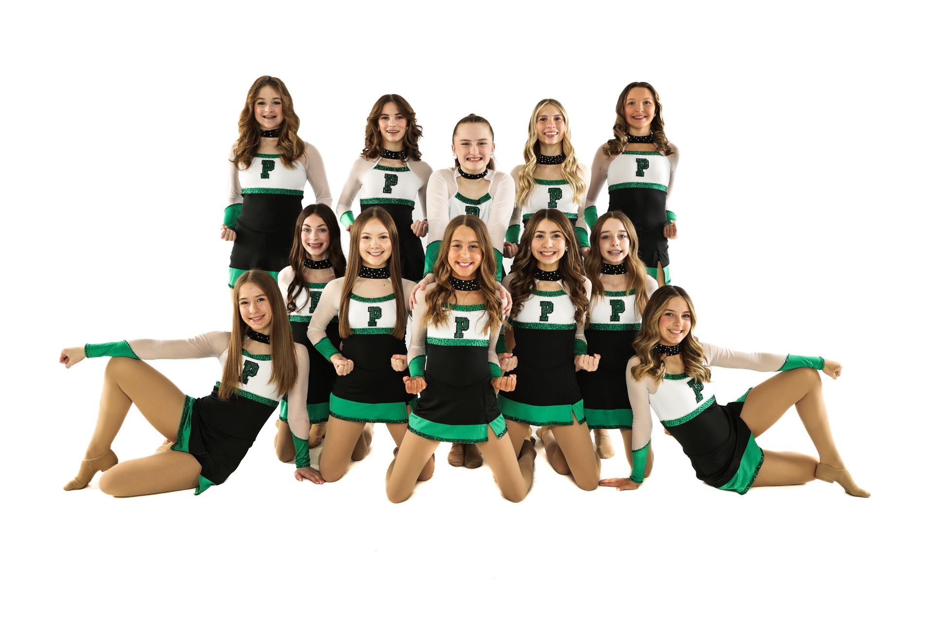 Cheer squad posed in green and black uniforms against a white background
