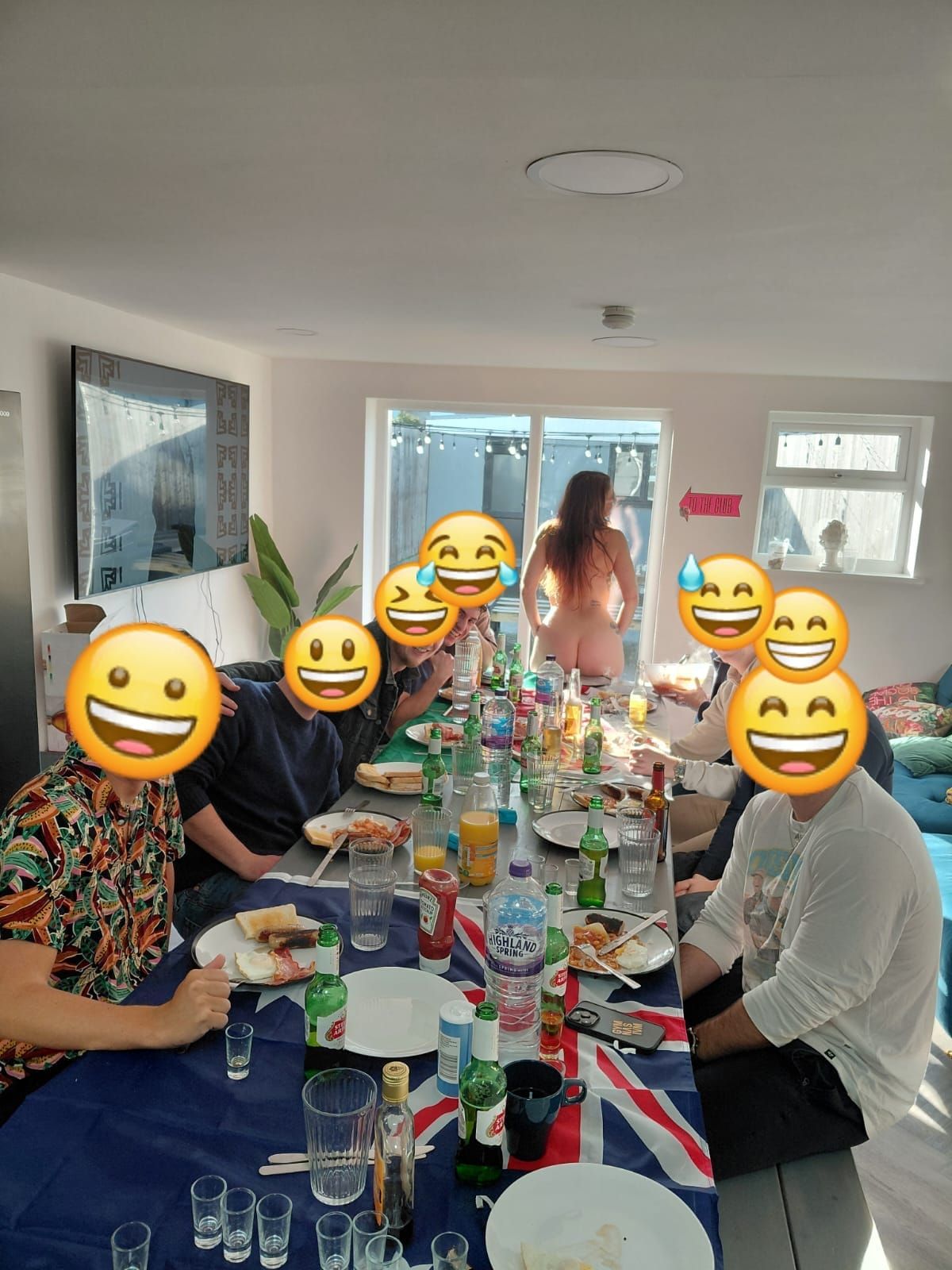 Nude breakfast in bed waitress serving a full English breakfast at a Cardiff stag party, wearing only an apron before revealing all. Fun, cheeky morning entertainment with guests enjoying breakfast and laughs at a private apartment.