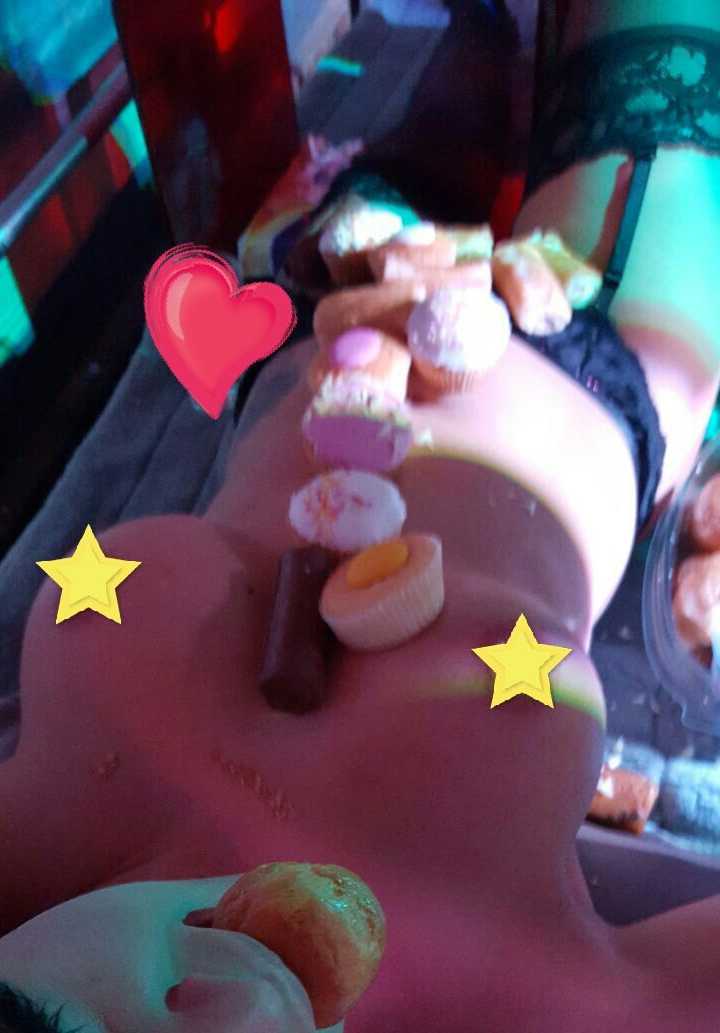 Female human food platter covered with colourful sweets, chocolates and desserts at a private party with Epic Moments UK.