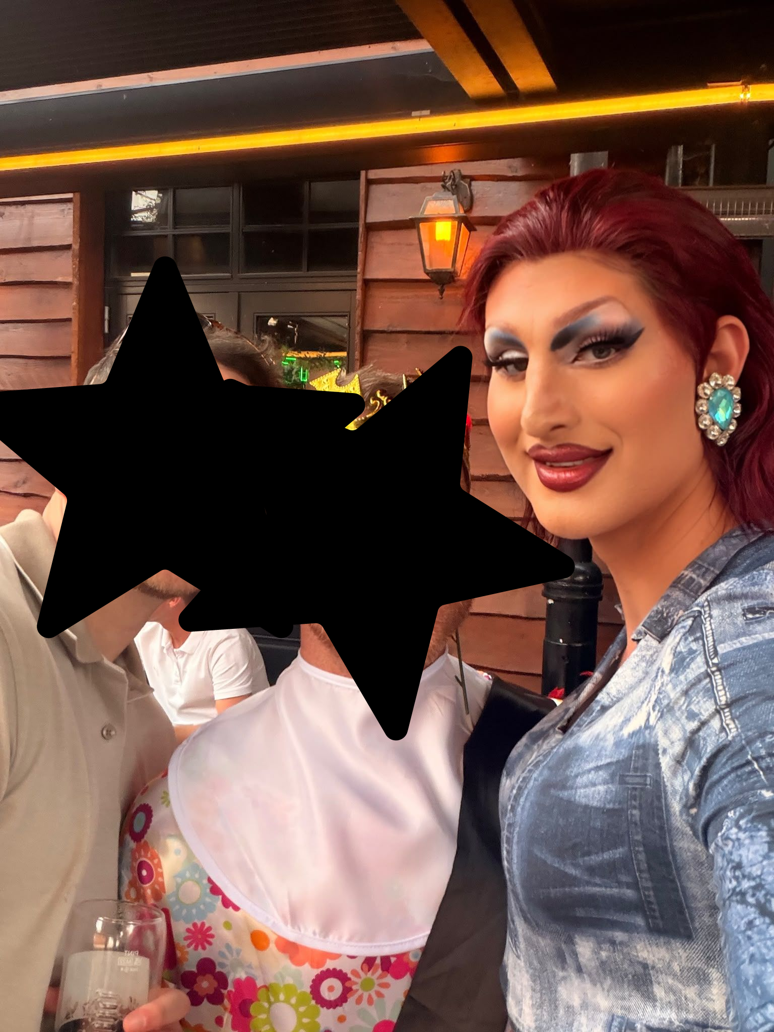 Babs Amore drag queen with a stag dressed as a big baby during a hilarious handcuffed stag party bar crawl in Cardiff