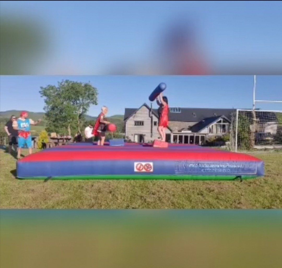 Hire gladiator girls to battle it out on an inflatable arena at your stag party
