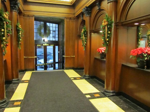 A hallway in a building decorated for christmas