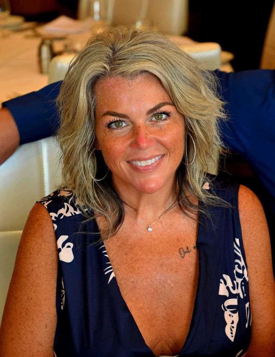 Marcia, Owner and CEO of JamsDoodlesandPoodles, smiling warmly.