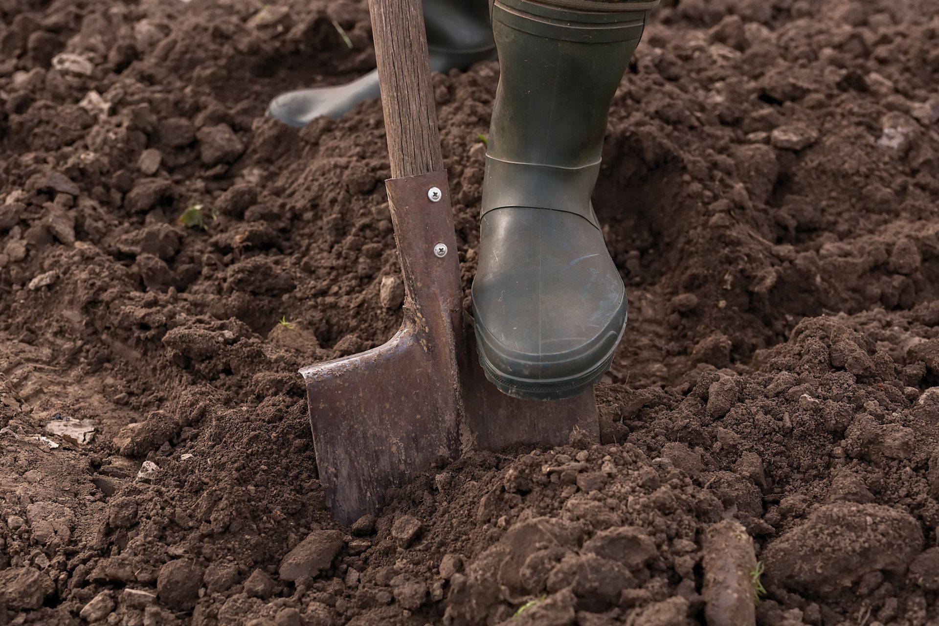 Male Feet Wearing Rubber Boots - Canton, OH - Warstler Bros Landscaping