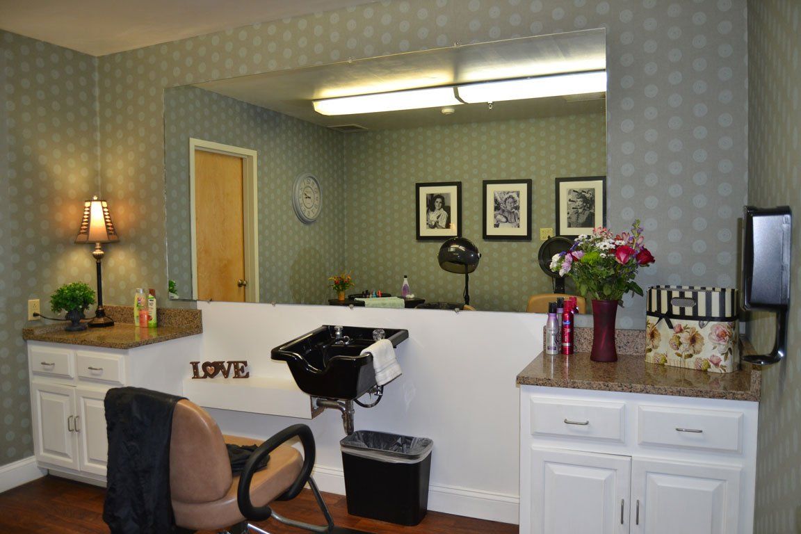 A salon with a sink and a sign that says love