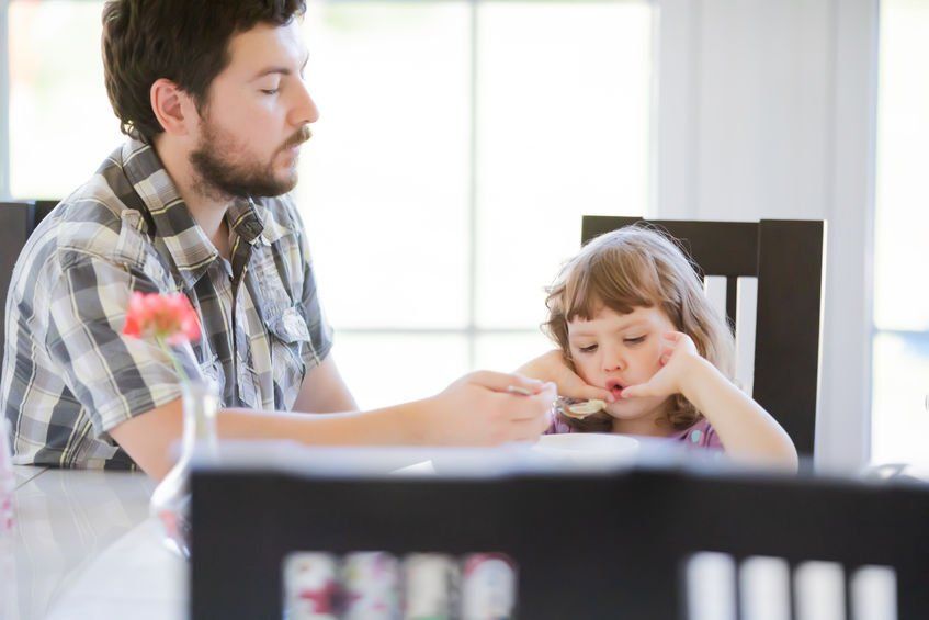 Dad tries to help a picky eater at mealtime