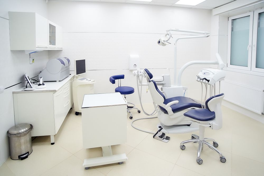 A Dental Office With a Dental Chair and a Desk — Stuart Pearce Electrical In Coffs Harbour, NSW