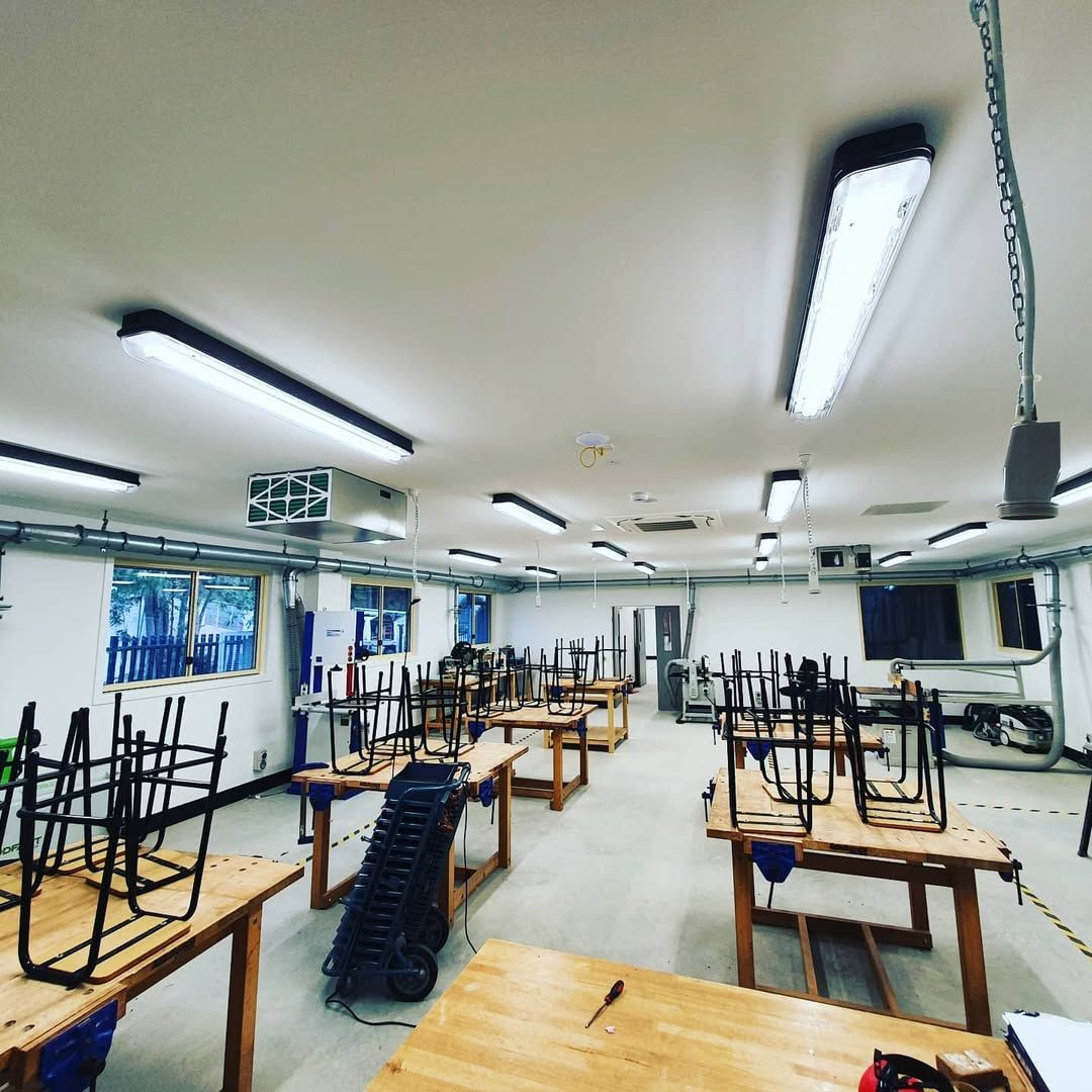 A Large Room With Lots of Wooden Tables and Chairs — Stuart Pearce Electrical In Coffs Harbour, NSW