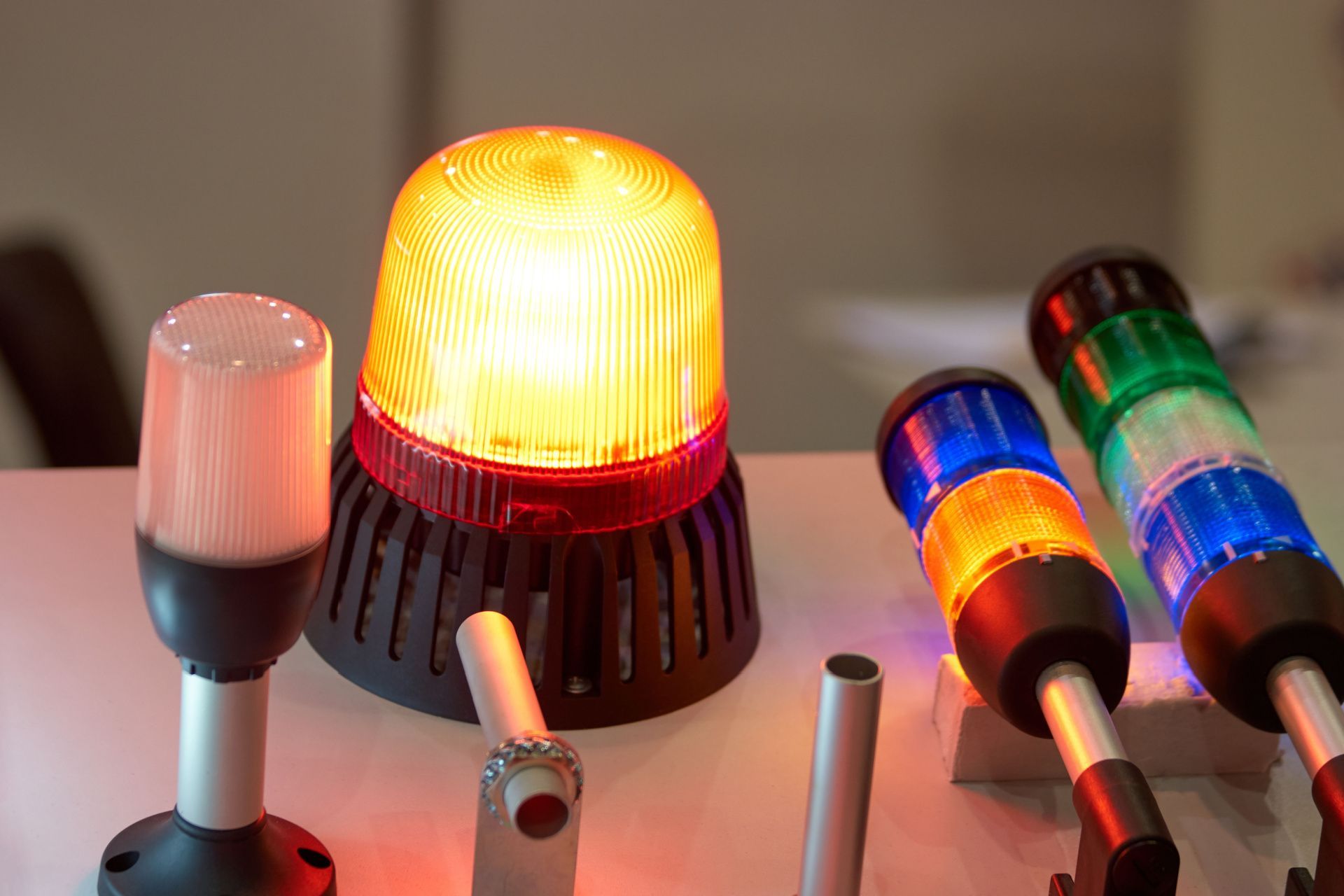 a bunch of different colored lights are sitting on a table .