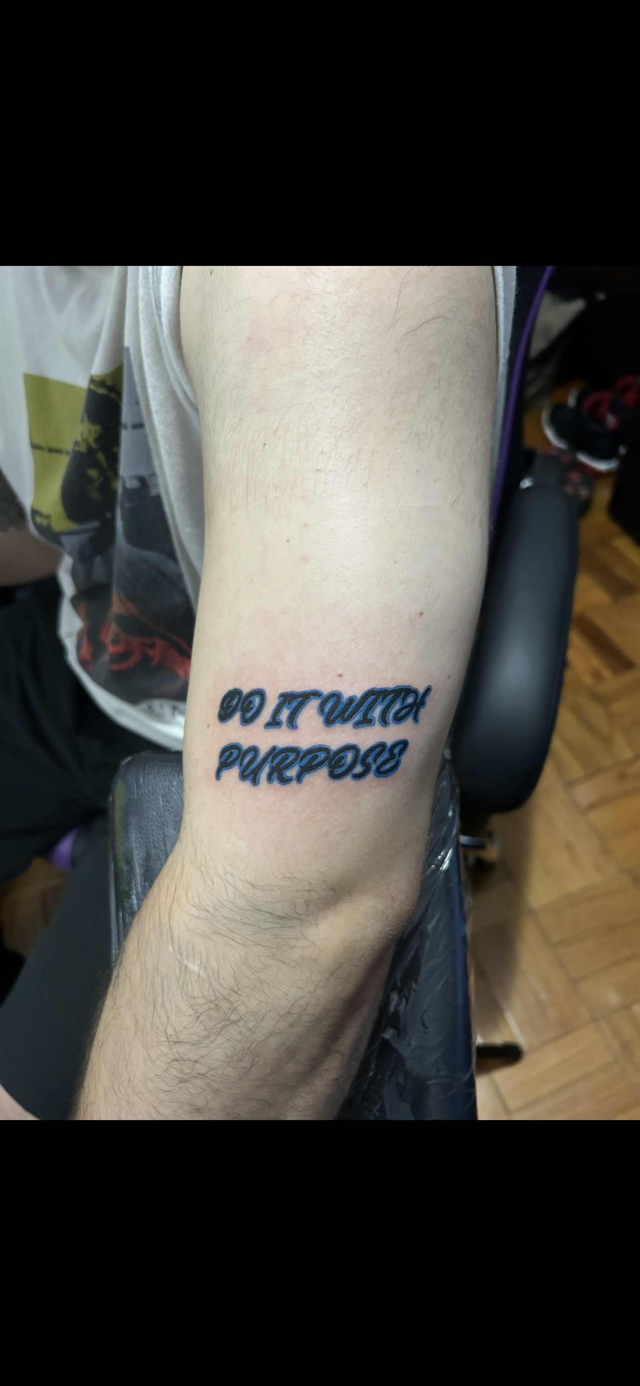 Tattoo on arm that says, 