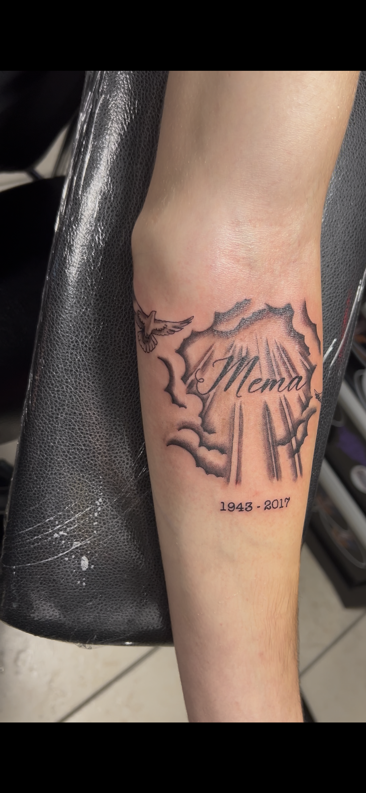 Tattoo on forearm: Abstract design with the word 