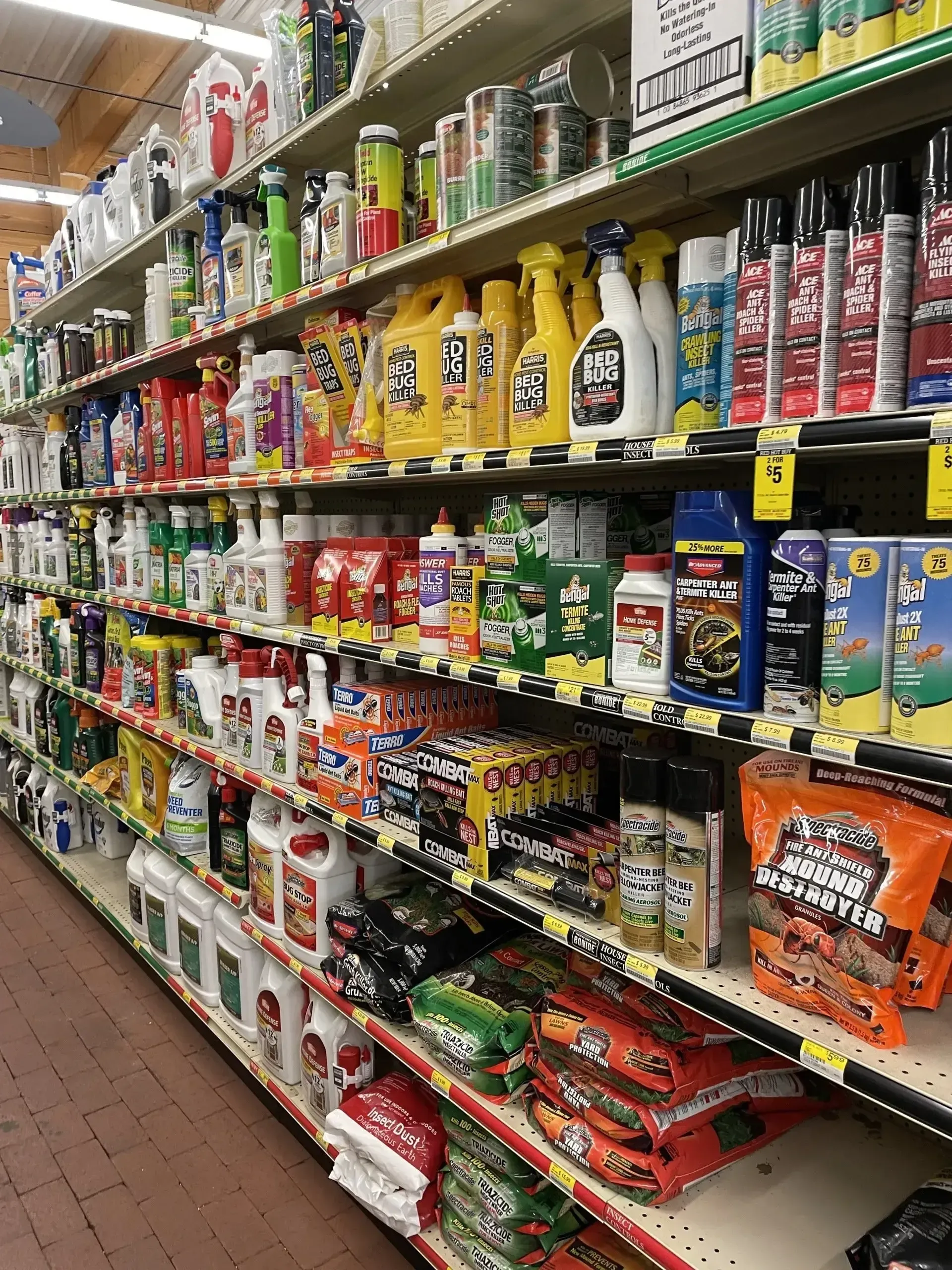 A grocery store aisle filled with lots of cleaning products.