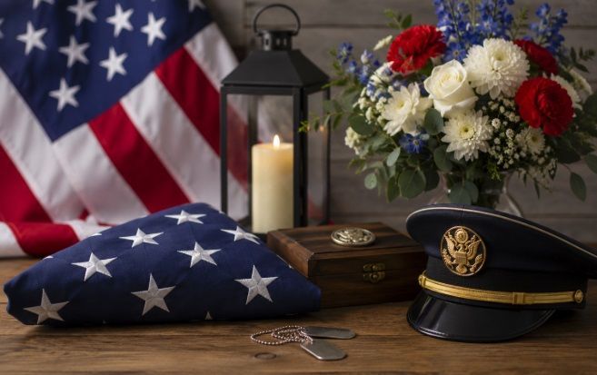 folded flag, flowers, candle, and service memorabilia for cremation service Kennebunk, ME