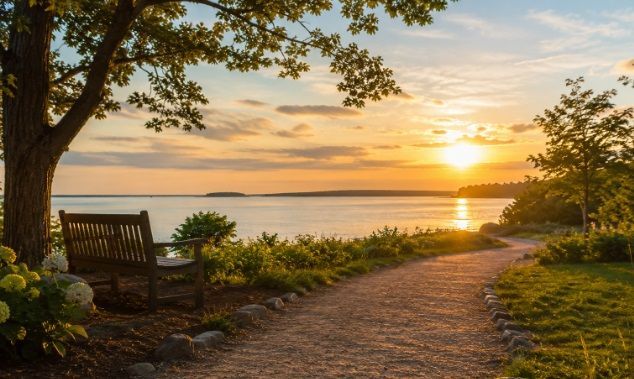 overlooking calm water at sunset, representing cremation service Scarborough, ME