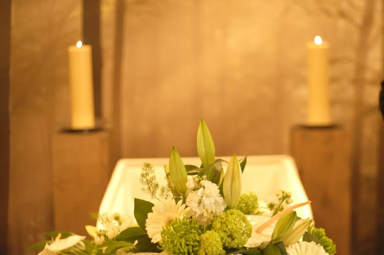 cremation service flowers with soft candlelight in Scarborough, ME