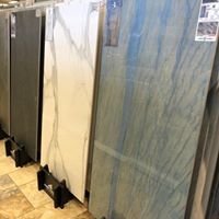A row of tiles sitting on top of each other on display in a store.