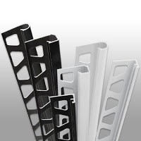 A group of metal pipes are stacked on top of each other on a white surface.