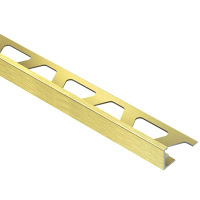 A close up of a brass tile trim on a white background.