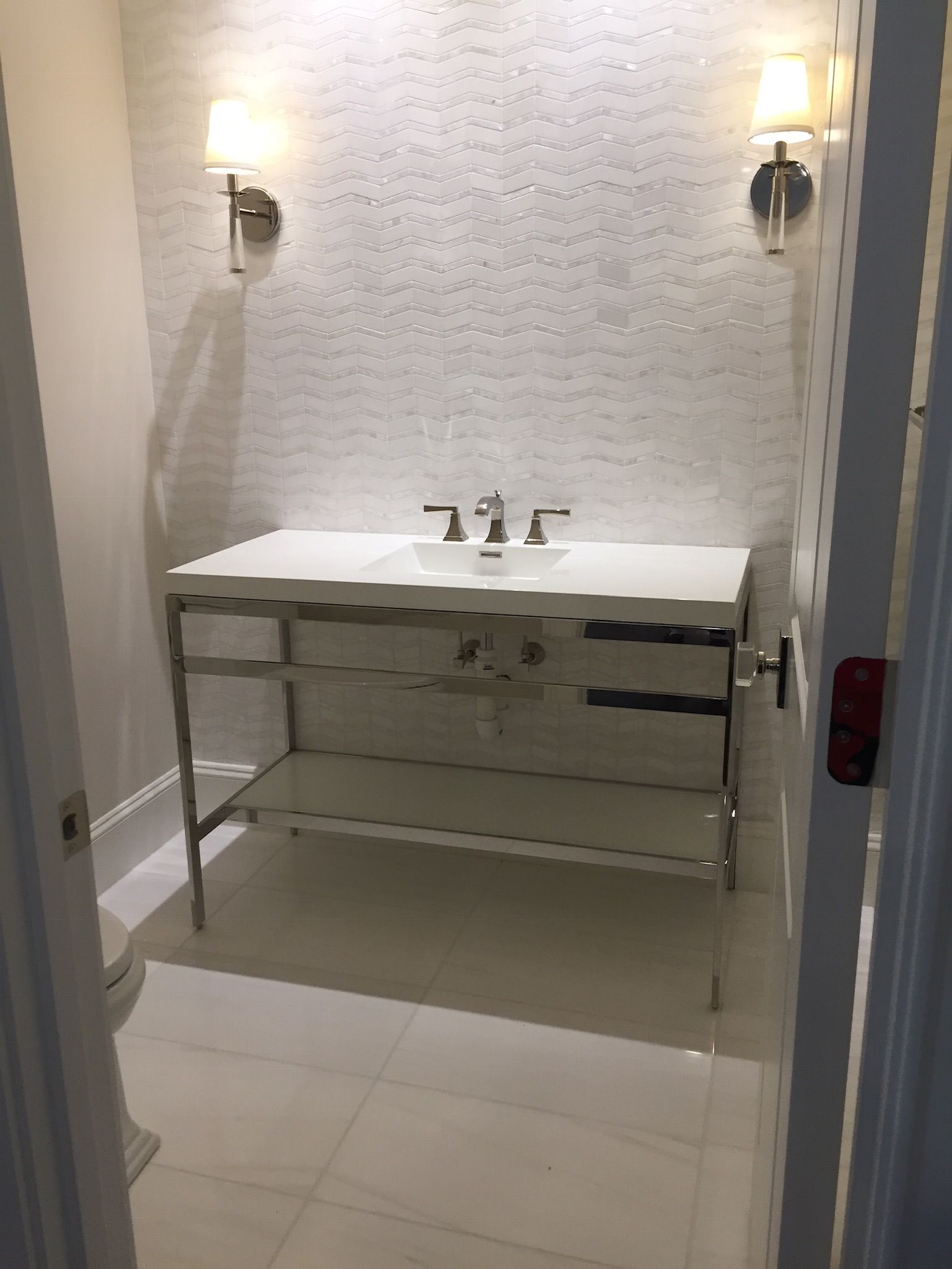 A bathroom with a sink and a toilet in it