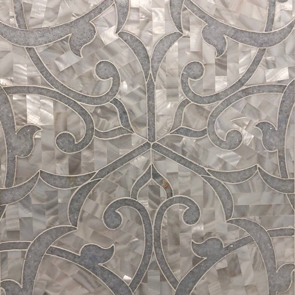 A close up of a tile with a pattern on it