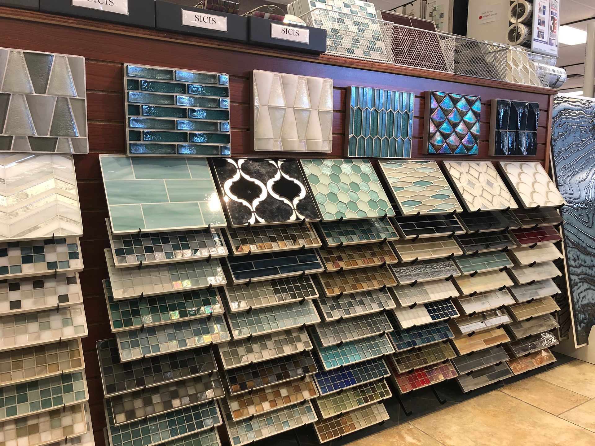 There are many different types of tiles on display in this store.