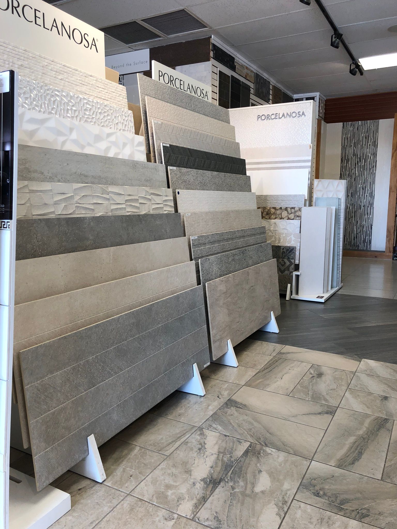 A showroom filled with lots of tiles on display.