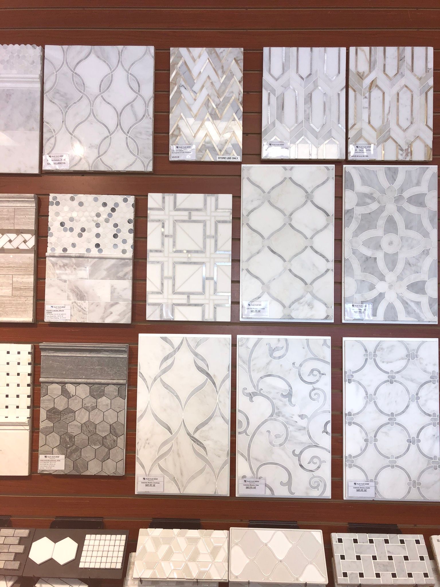 A wall with a variety of tiles on it