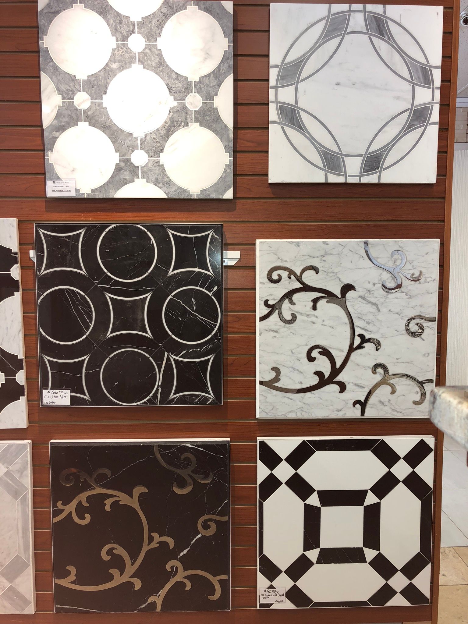 A display of black and white tiles on a wall