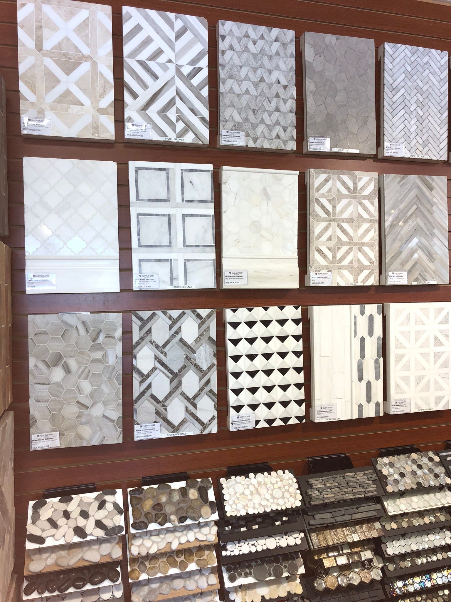 There are many different types of tiles on display in a store.