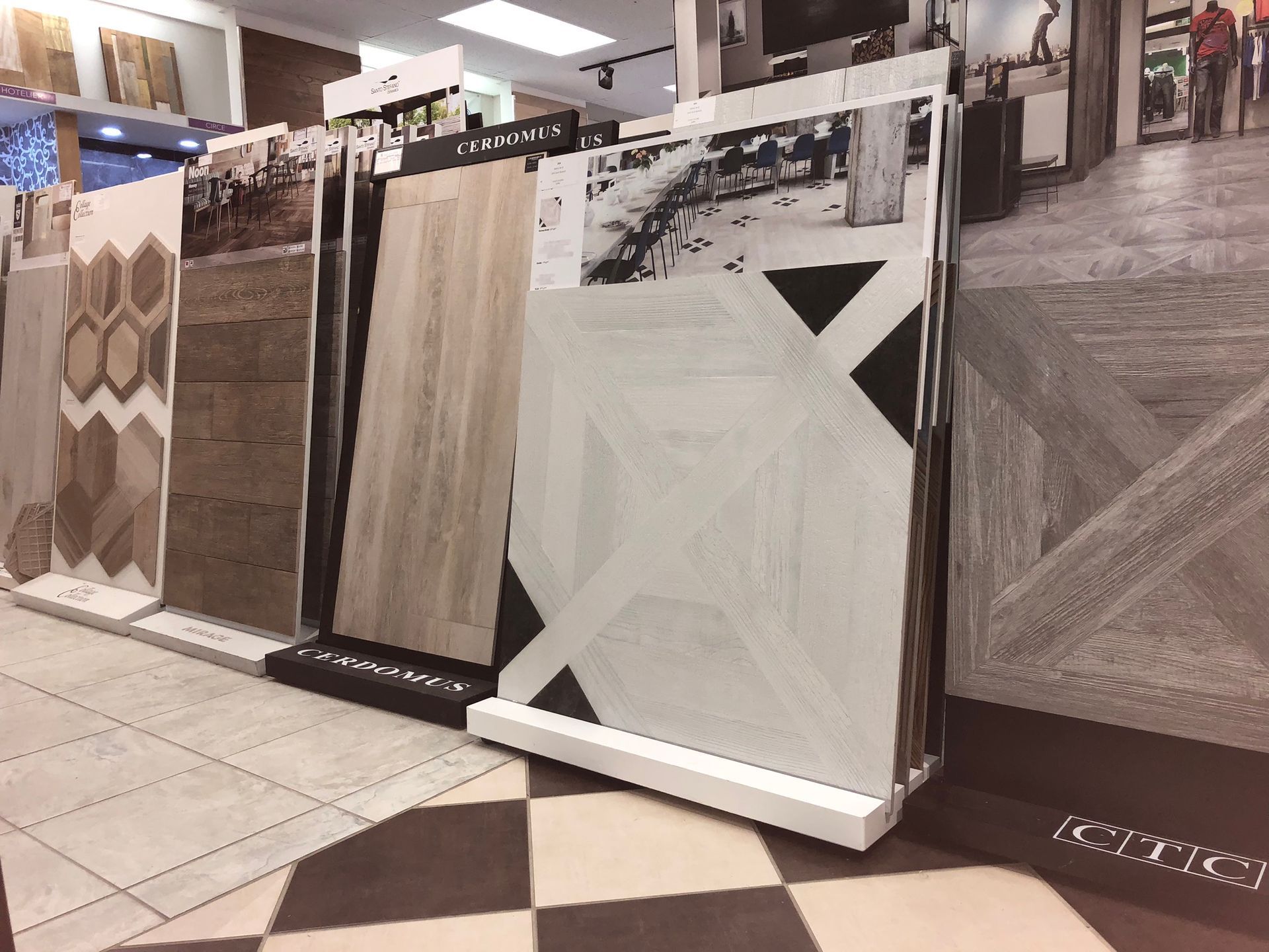 A display of tiles in a store with a checkered floor