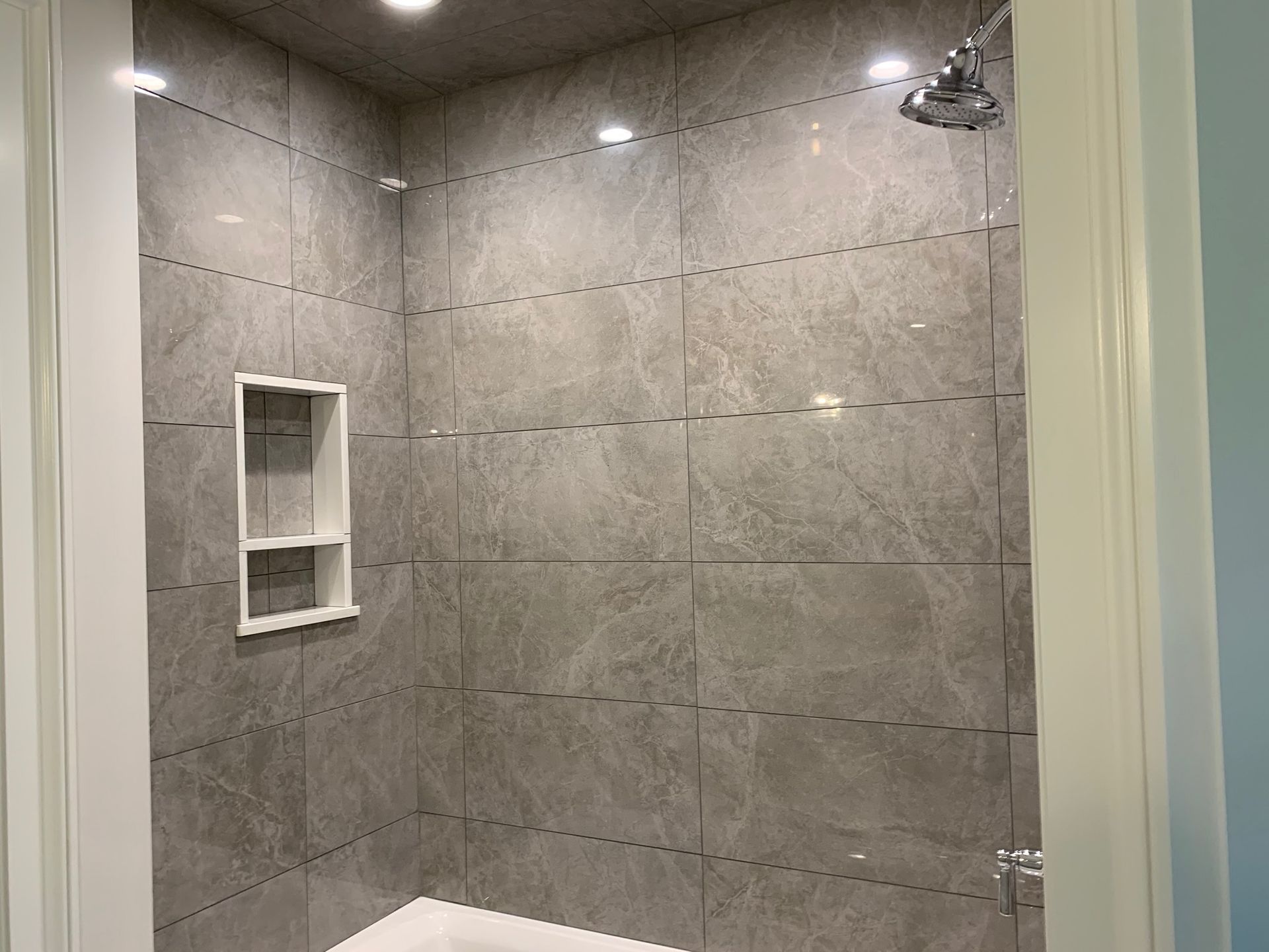 A bathroom with a shower and a bathtub.