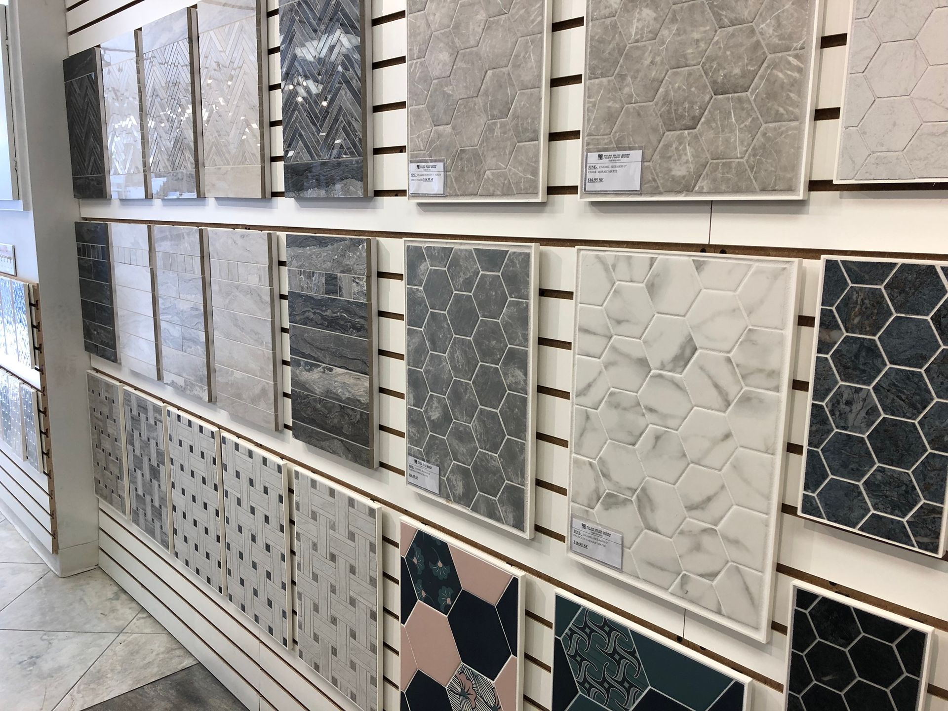 A display of tiles on a wall in a store