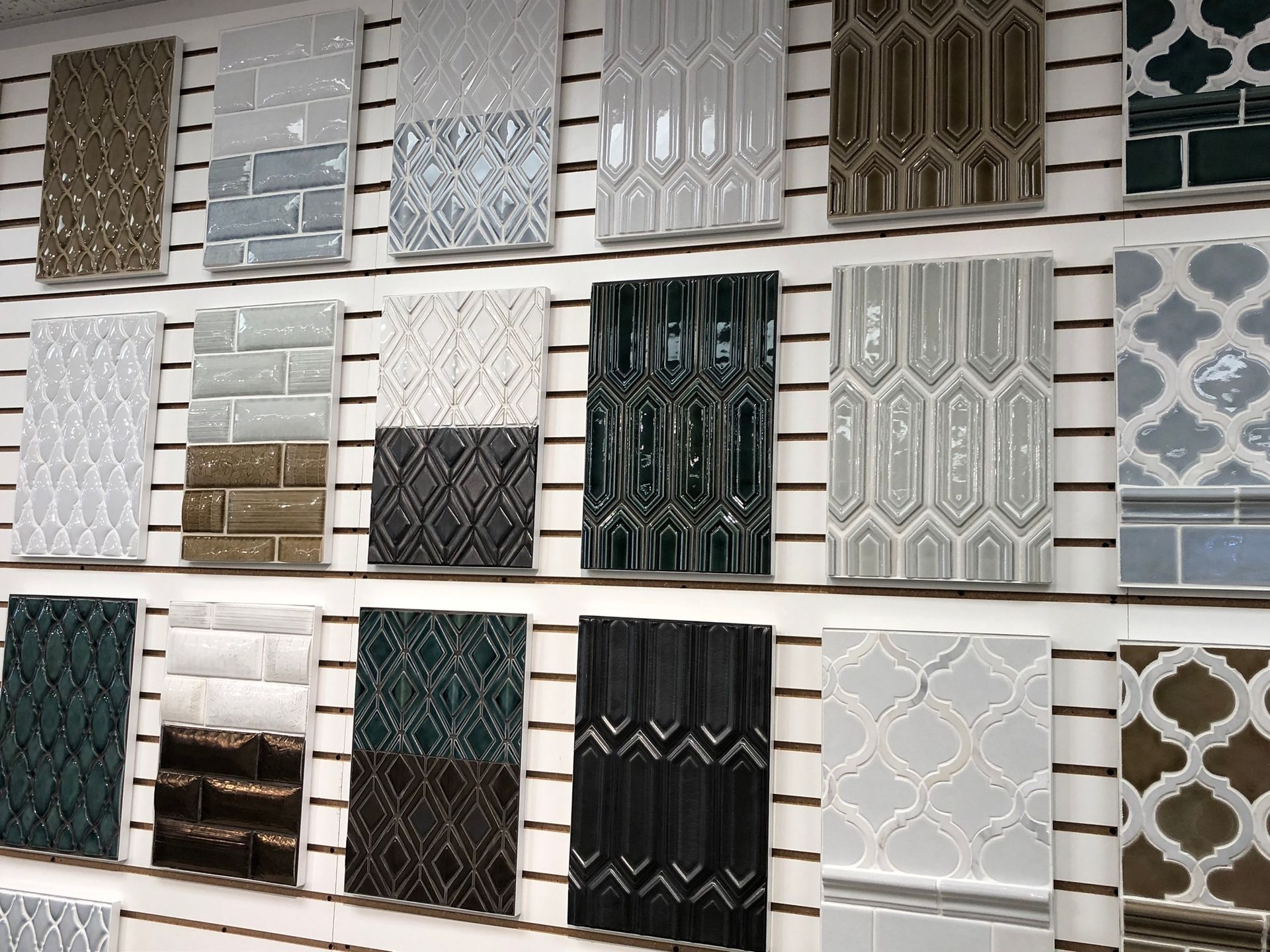 A wall filled with lots of different types of tiles.