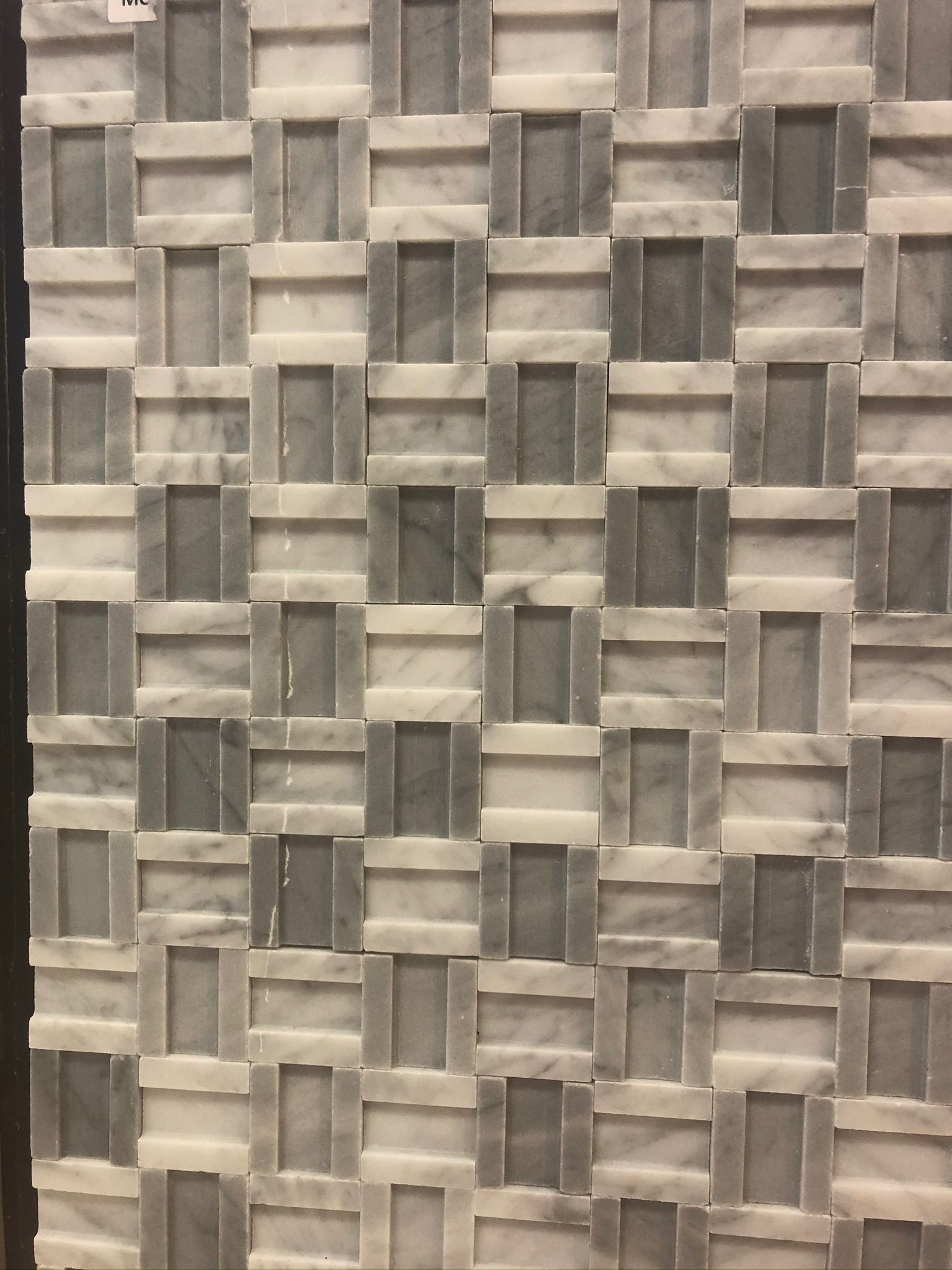 A wall with a pattern of squares on it