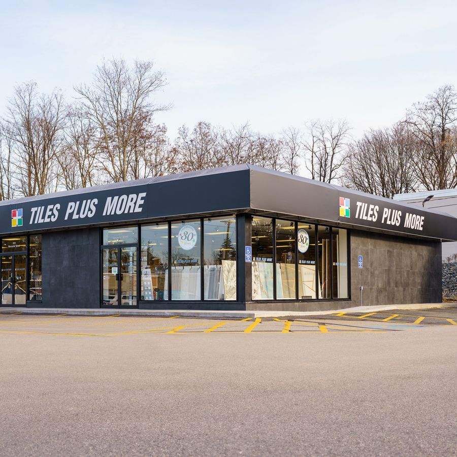 A tiles plus more store with a lot of windows