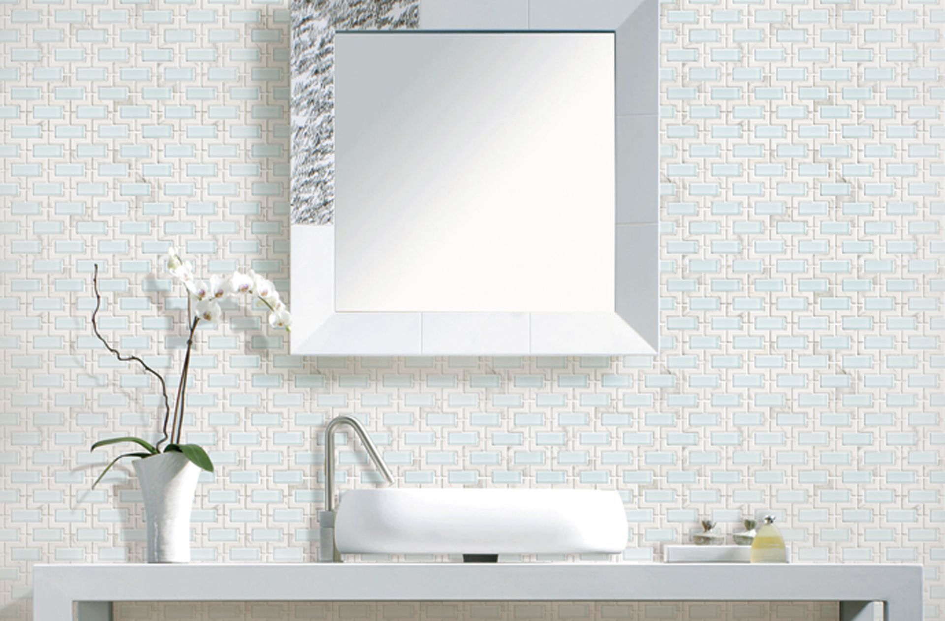 A bathroom with a sink and a mirror above it