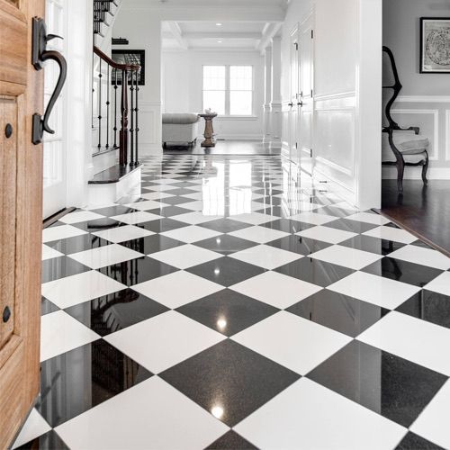 A black and white checkered floor in a hallway