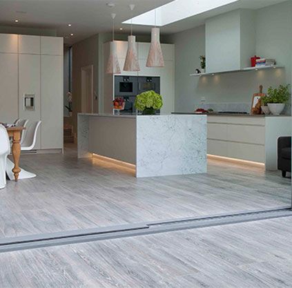 There is a large island in the middle of the kitchen.