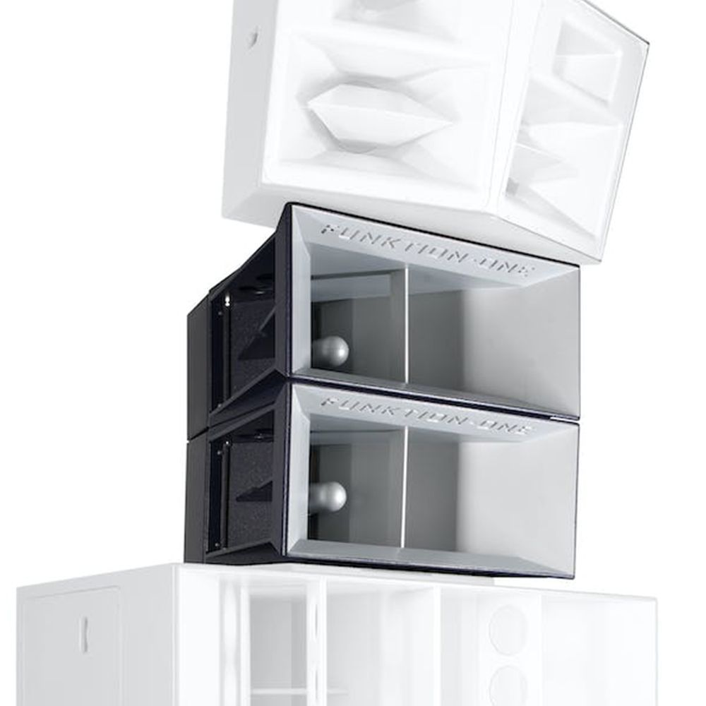 Stacked white and grey Funktion-One horn speakers with subwoofers in a tall audio array.